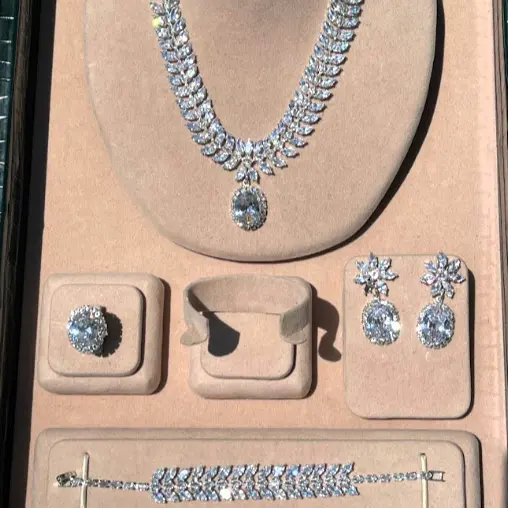 Luxury floral motif necklace, earring, ring, and bracelet set - with large oval-shaped zircon stones, rhodium plated.