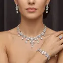 Luxury star pattern necklace, earring, ring, and bracelet set - with teardrop-shaped zircon stones, rhodium plated.