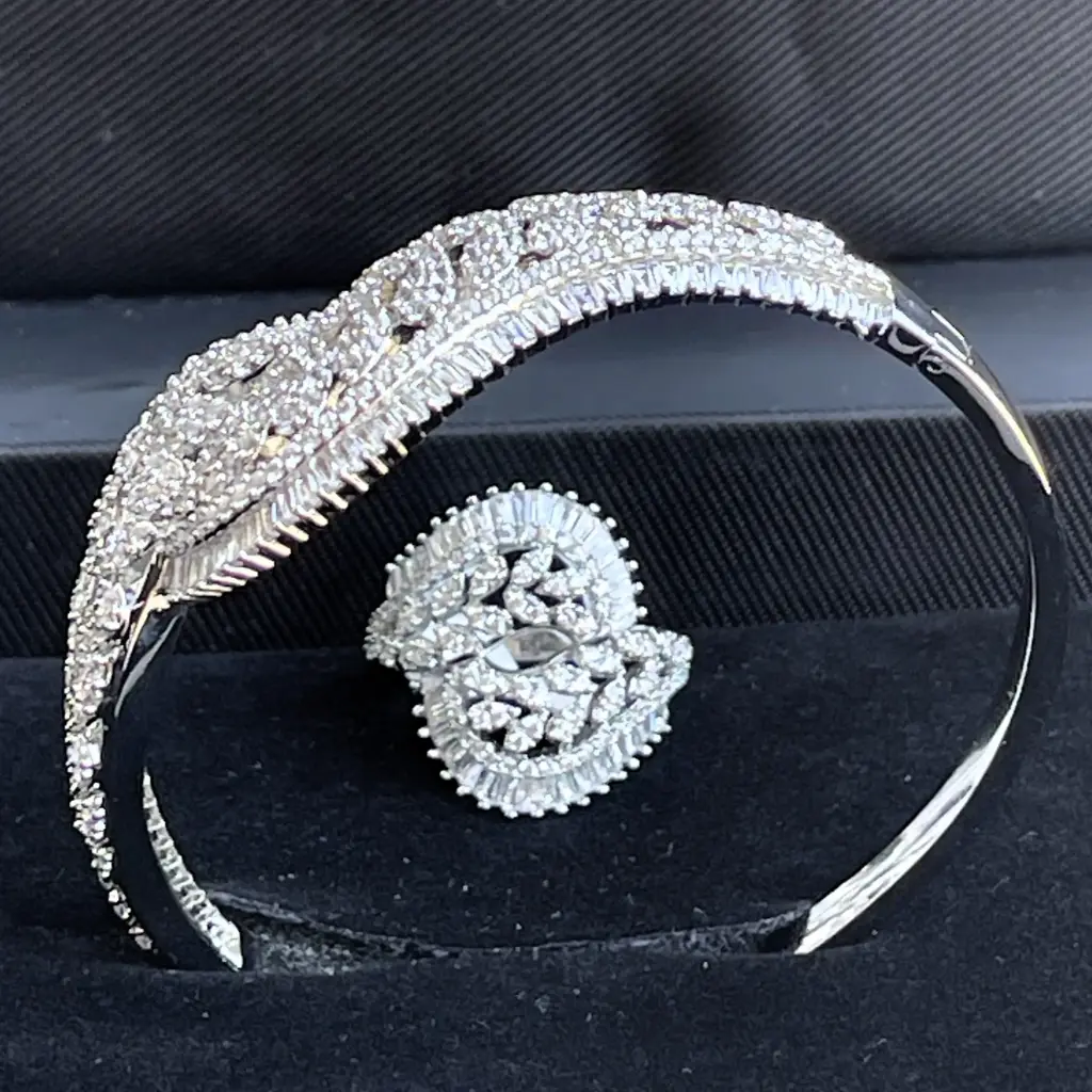 Luxury floral motif bracelet and ring - with leaf-shaped zircon stones, rhodium plated.