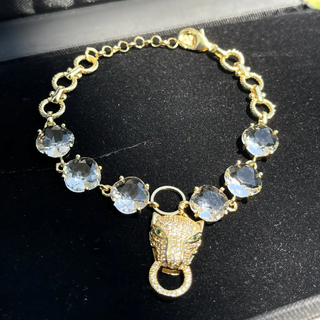 Rhodium plated luxury gold chain bracelet with tiger head-shaped cubic zirconia stones.