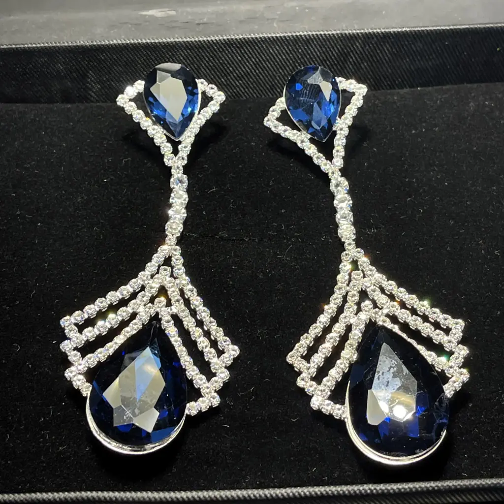 Luxurious earring set in various colors, adorned with eye-catching teardrop-shaped zircon stones - rhodium plated.